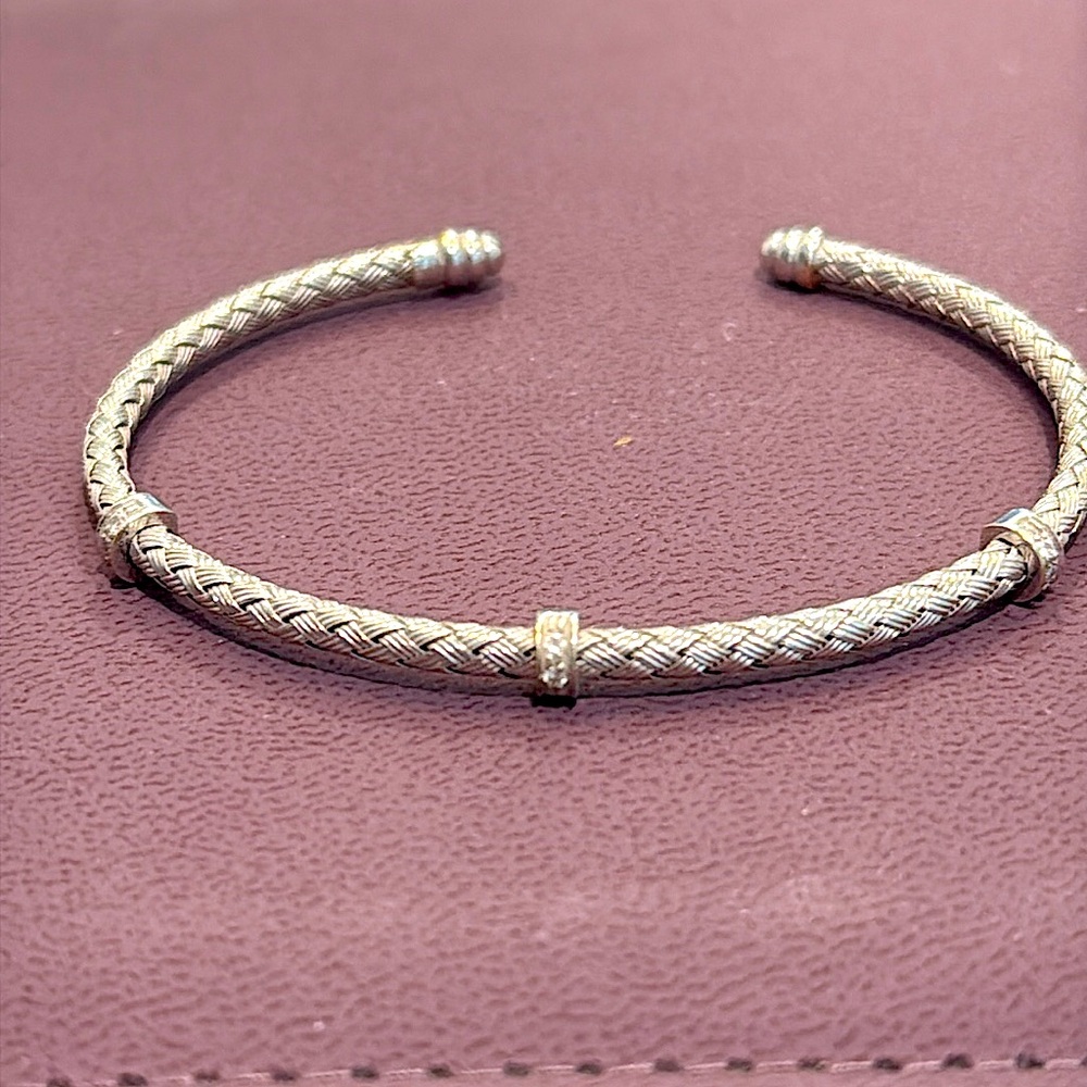 Roberto Coin “silk weave” cuff bracelet with 3 diamond pave accents.